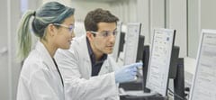 An image of two lab technicians at work